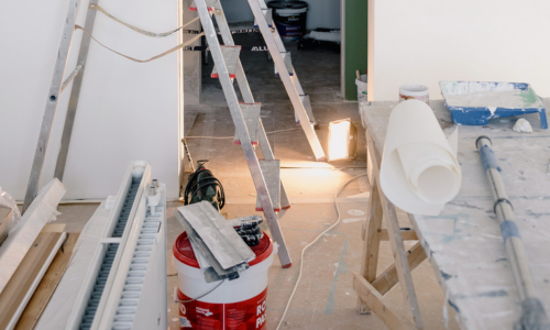 A room being renovated with contractor supplies laid out